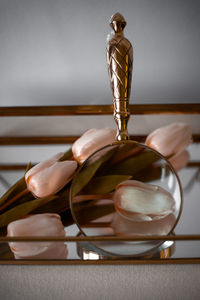 High angle view of figurine on table against wall