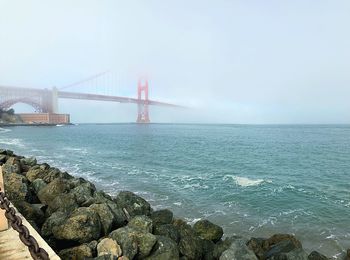 View of suspension bridge over sea