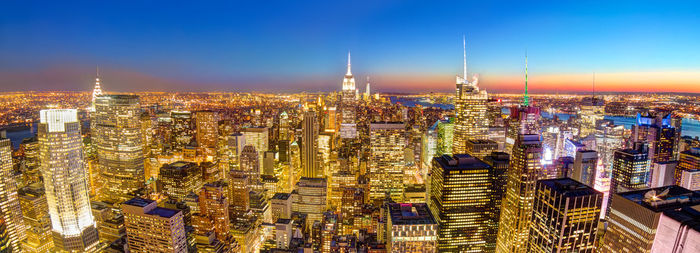 Aerial view of illuminated buildings in city