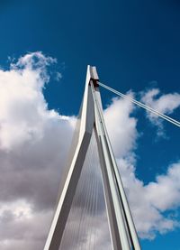 Low angle view of bridge against cloudy sky