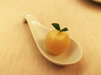 Close-up of fruit in spoon on table