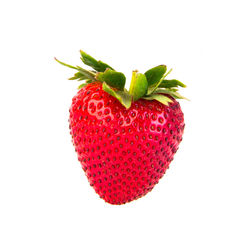 Close-up of strawberry over white background