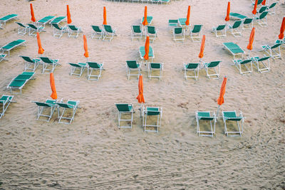 High angle view of deck chairs on beach