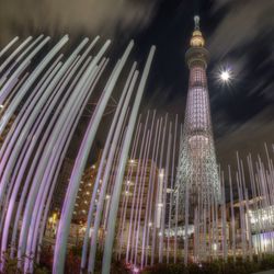 Low angle view of illuminated tower