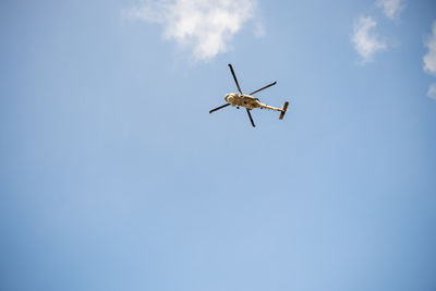 Low angle view of airplane flying against clear sky