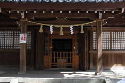 Entrance of temple against building