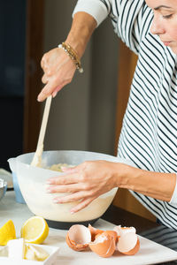 Midsection of woman preparing food