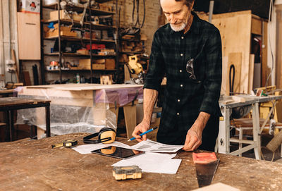 Carpenter working in workshop