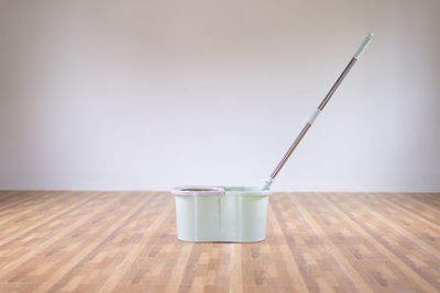 Close-up of drink on table against wall