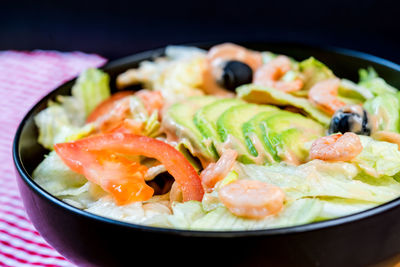 Close-up of salad with prawns served in bowl