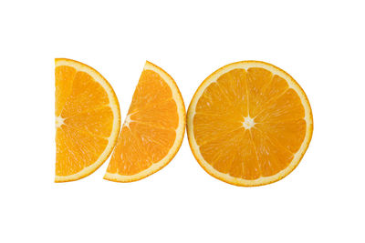 Close-up of orange fruit against white background