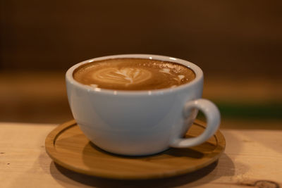 Close-up of coffee cup on table