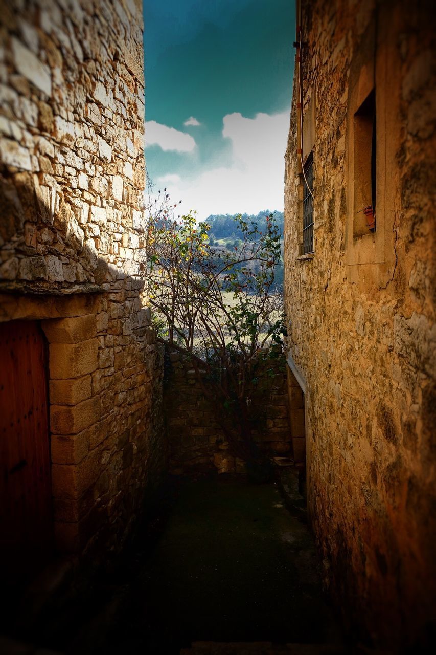 NARROW ALLEY AMIDST BUILDINGS