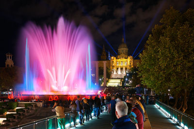 Group of people watching fountain show