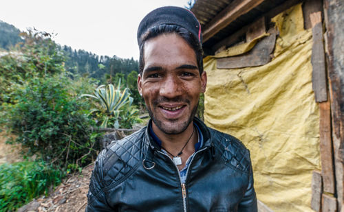 Portrait of young man standing outdoors