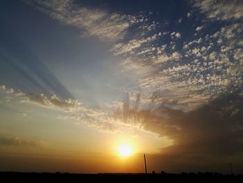 Silhouette trees against sky during sunset