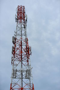 Low angle view of communications tower against sky