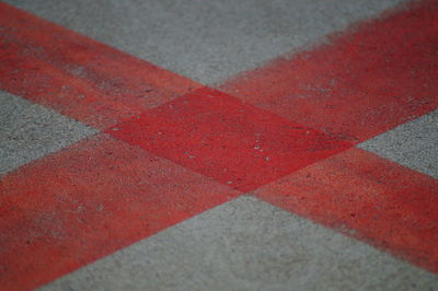 High angle view of red road marking on street