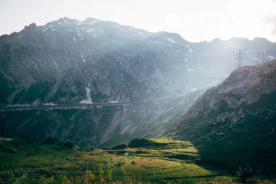 Scenic view of landscape and mountains against sky