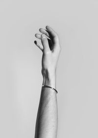 Close-up of man with hand on white background