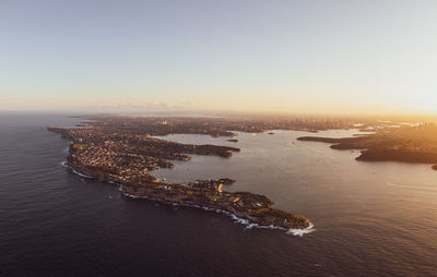 Drone view of south head, watsons bay with sydney harbour, cbd and harbour bridge in the background