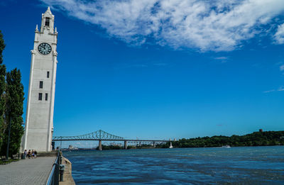 Low angle view of bridge against cloudy sky