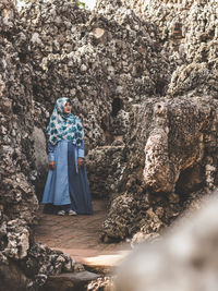 Woman standing on rock