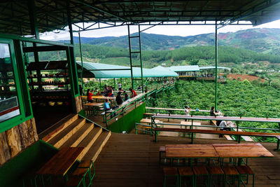 High angle view of people on table against trees