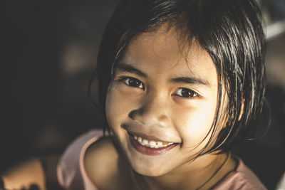 Close-up portrait of smiling girl