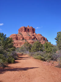 Rock formations on landscape against clear sky