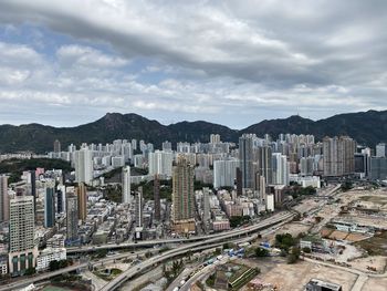 High angle view of buildings in city against sky