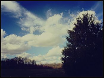 Scenic view of landscape against cloudy sky