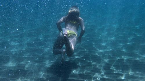 Woman swimming in sea