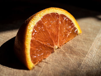 Close-up of orange slice on table