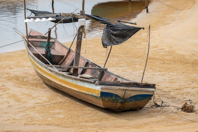 Boat moored on shore