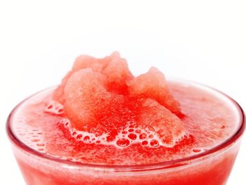 Close-up of drink in glass over white background