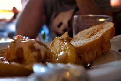 Close-up of hand holding ice cream in plate
