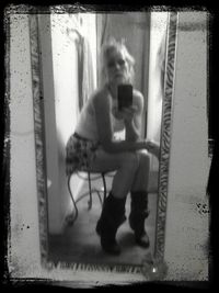 Full length of woman standing on bench