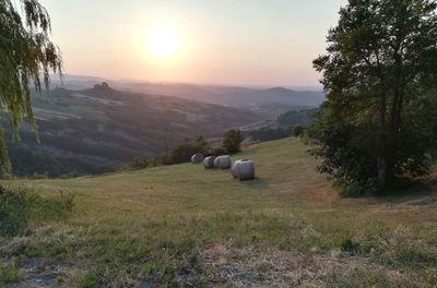 Scenic view of landscape against sky during sunset