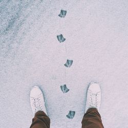 Low section of man standing on shoes