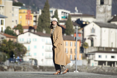 Man standing on street in city