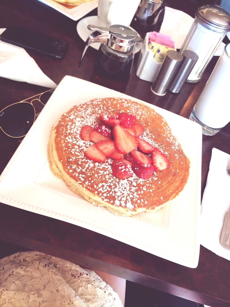 food and drink, indoors, food, freshness, sweet food, still life, table, ready-to-eat, indulgence, dessert, plate, strawberry, high angle view, close-up, unhealthy eating, fruit, cake, temptation, breakfast