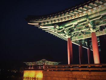 Low angle view of illuminated building at night