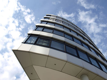 Low angle view of building against cloudy sky