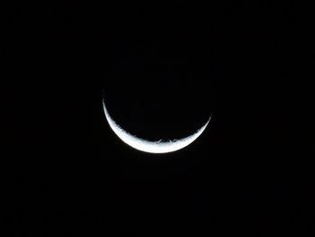 Low angle view of moon against sky at night