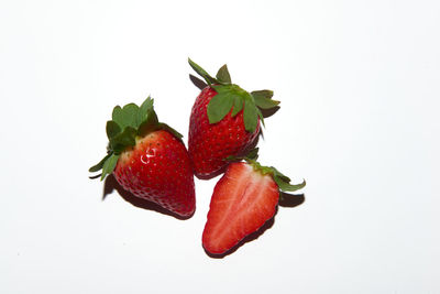 Close-up of strawberry over white background