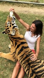 Midsection of woman holding hands