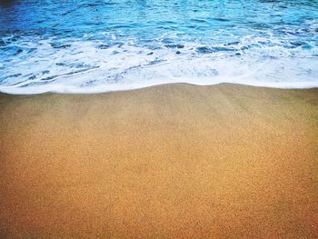 High angle view of surf on beach