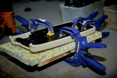 Close-up of hand holding blue table