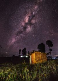 Scenic view of field against sky at night